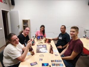 Learners playing a cooperative game in English during which fluent English is practiced